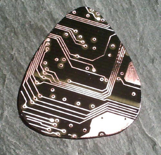 Illustration for article titled Shred Like a Geek: Recycled Circuit Board Guitar Picks